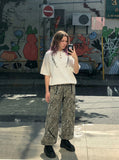 DAXUEN Vintage embroidered Henley collar short-sleeved top — model photo