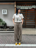 DAXUEN Vintage graphic Henley T-shirt with distressed print — model photo