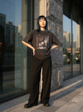 DAXUEN Vintage oversized graphic t-shirt in washed black — model photo