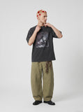 DAXUEN Vintage oversized graphic t-shirt in washed black — model photo