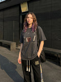 DAXUEN Vintage graphic t-shirt featuring musical instruments — model photo