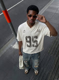 DAXUEN Vintage graphic V-neck t-shirt — model photo