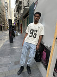 DAXUEN Vintage graphic V-neck t-shirt — model photo