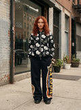 DAXUEN Black wide-leg sweatpants with vintage graphics — model photo