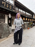 DAXUEN Light grey short-sleeved polo shirt with embroidered details — model photo