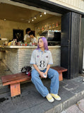 DAXUEN Light grey short-sleeved polo shirt with embroidered details — model photo