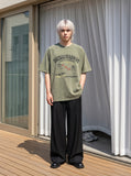DAXUEN Olive green short-sleeved graphic t-shirt with dog print — model photo