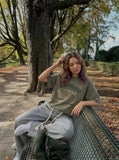 DAXUEN Olive green short-sleeved graphic t-shirt with dog print — model photo