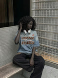 DAXUEN Vintage ombre graphic T-shirt with multiple designs — model photo