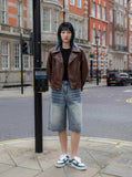 DAXUEN Wide-leg denim shorts with distressed finish — model photo