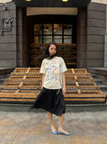 DAXUEN Vintage-washed graphic t-shirt with collage print — model photo