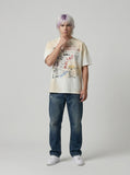 DAXUEN Vintage-washed graphic t-shirt with collage print — model photo
