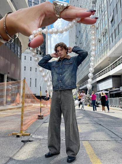 DAXUEN Wide leg denim pants with curved panels and topstitching — model photo