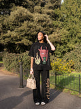 DAXUEN Oversized short-sleeved waffle knit t-shirt with graphic print — model photo