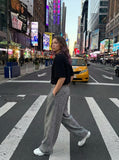 DAXUEN Waffle knit half-zip short sleeve top in grey and black — model photo