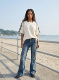 DAXUEN Oversized V-neck t-shirt with waffle knit texture and embroidery — model photo