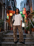 DAXUEN Oversized V-neck t-shirt with waffle knit texture and embroidery — model photo