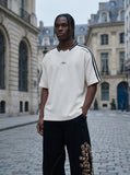 DAXUEN Oversized V-neck t-shirt with waffle knit texture and embroidery — model photo