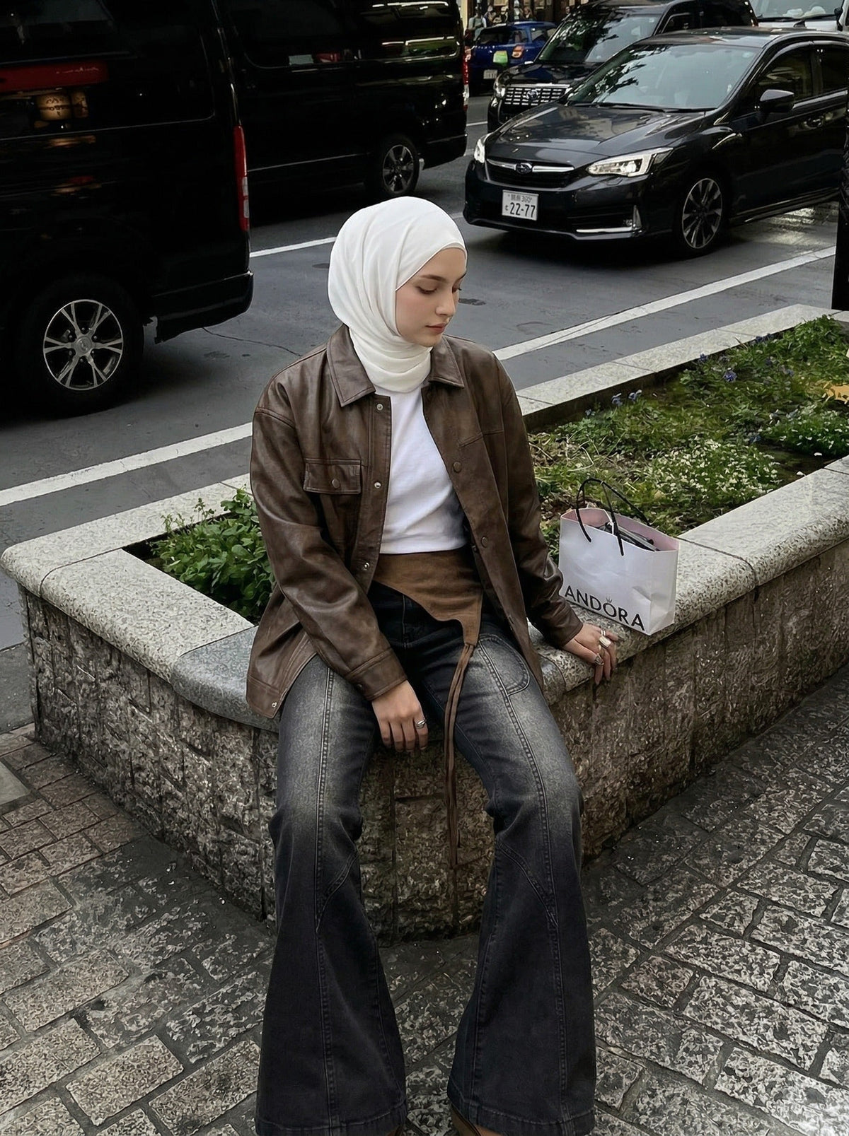 DAXUEN Washed black flared jeans with brown faux suede panel — model photo