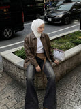 DAXUEN Washed black flared jeans with brown faux suede panel — model photo