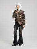 DAXUEN Washed black flared jeans with brown faux suede panel — model photo