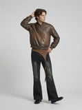 DAXUEN Washed black flared jeans with brown faux suede panel — model photo
