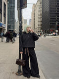 DAXUEN Washed black oversized hooded sweatshirt — model photo