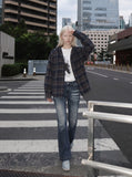 DAXUEN Flared blue denim jeans with distressed finish — model photo