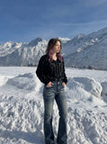 DAXUEN Flared blue denim jeans with distressed finish — model photo