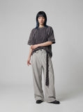 DAXUEN Oversized distressed short-sleeved t-shirt with paneling — model photo