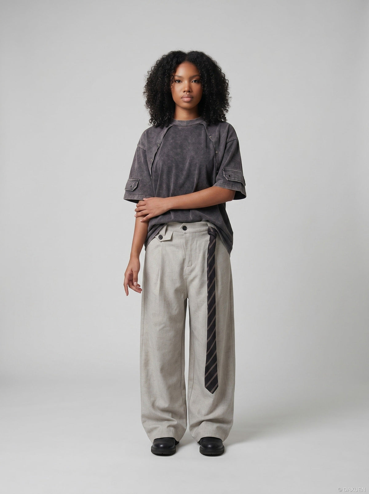 DAXUEN Oversized distressed short-sleeved t-shirt with paneling — model photo