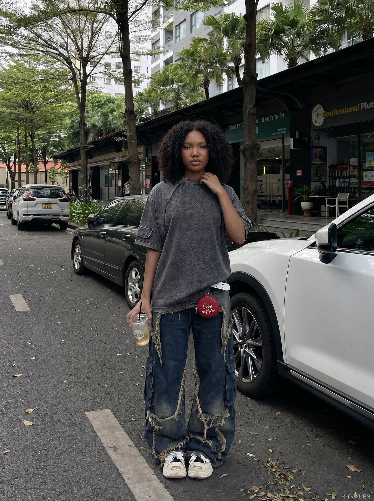 DAXUEN Oversized distressed short-sleeved t-shirt with paneling — model photo