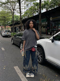 DAXUEN Oversized distressed short-sleeved t-shirt with paneling — model photo
