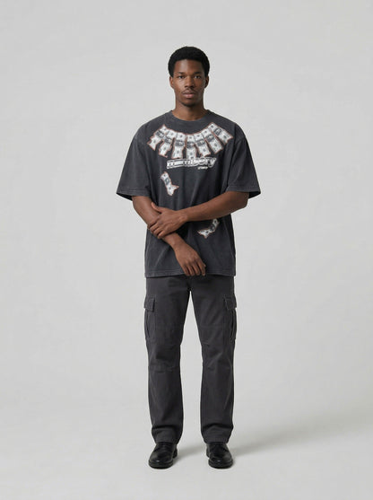 DAXUEN Washed oversized graphic t-shirt with dollar bills and 'misery' print — model photo