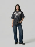 DAXUEN Washed oversized graphic t-shirt with dollar bills and 'misery' print — model photo
