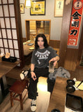 DAXUEN Washed oversized graphic t-shirt with dollar bills and 'misery' print — model photo