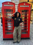 DAXUEN washed olive wide-leg denim trousers — model photo