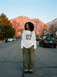 DAXUEN washed olive wide-leg denim trousers — model photo