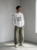 DAXUEN washed olive wide-leg denim trousers — model photo