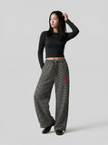 DAXUEN Black and white striped wide-leg track pants — model photo