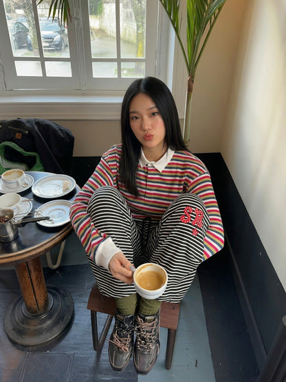 DAXUEN Black and white striped wide-leg track pants — model photo