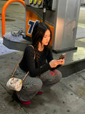 DAXUEN Black and white striped wide-leg track pants — model photo