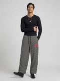 DAXUEN Black and white striped wide-leg track pants — model photo