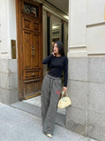 DAXUEN Black and white striped wide-leg track pants — model photo