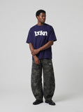 DAXUEN navy blue oversized wavy wordmark graphic T-shirt — model photo