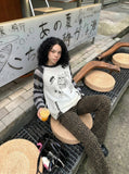 DAXUEN Long-sleeved knitted sweater with cat graphic — model photo