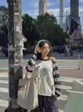 DAXUEN Long-sleeved knitted sweater with cat graphic — model photo