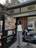 DAXUEN Long-sleeved knitted sweater with cat graphic — model photo