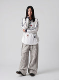 DAXUEN white v-neck heart motif long-sleeve top — model photo
