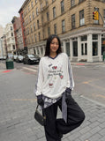 DAXUEN white v-neck heart motif long-sleeve top — model photo